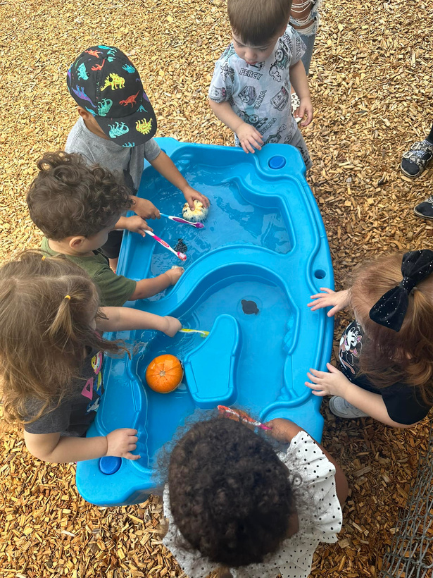 Children playing in water table